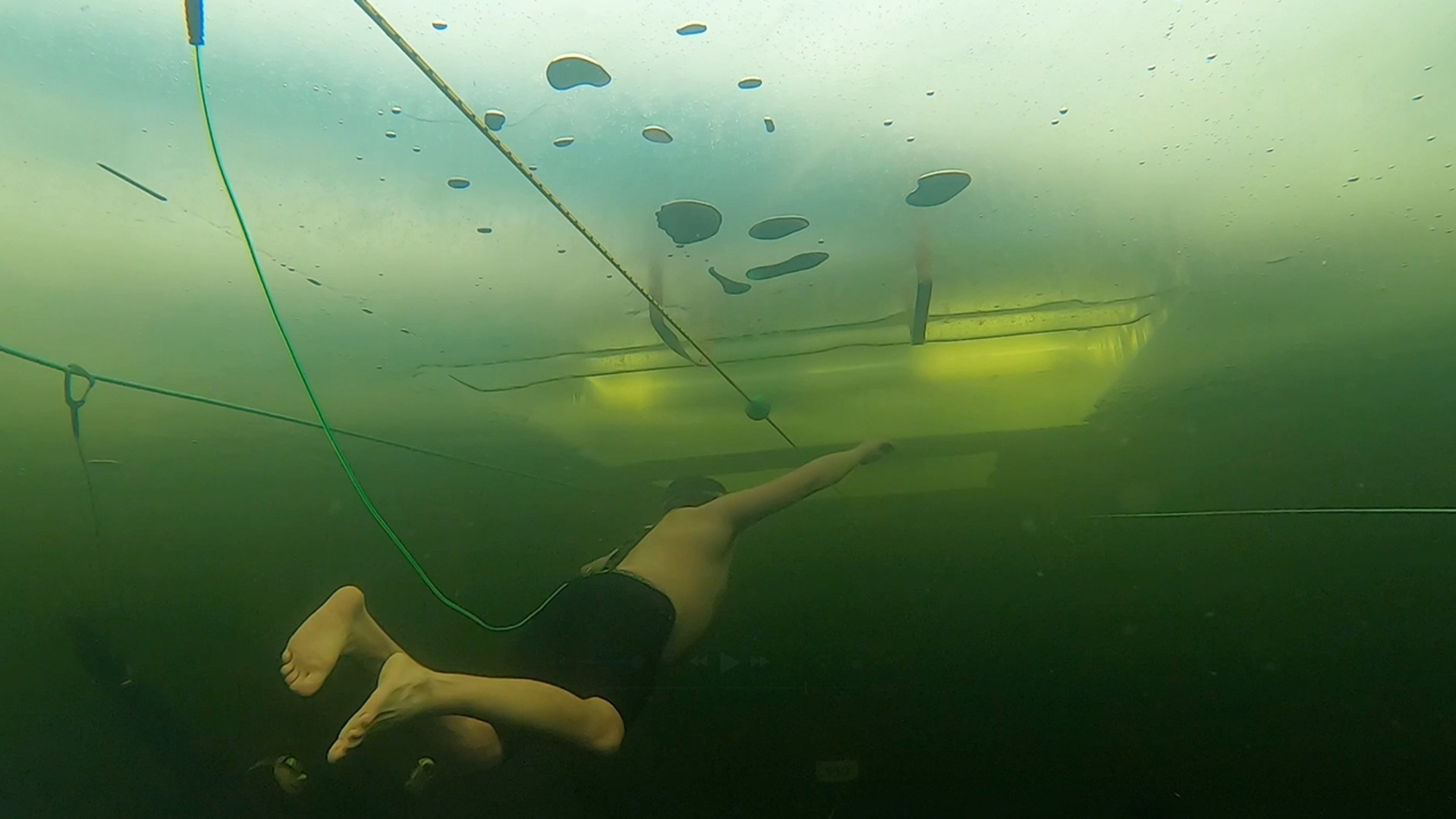 'Video thumbnail for Ice swimmer travels under sheet in cold plunge'