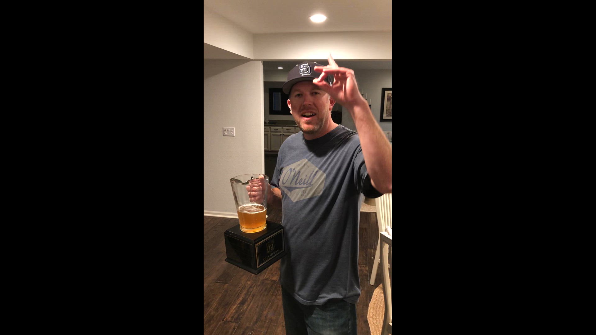 Fantasy Football Trophy Presentation with a Pitcher of Craft Beer