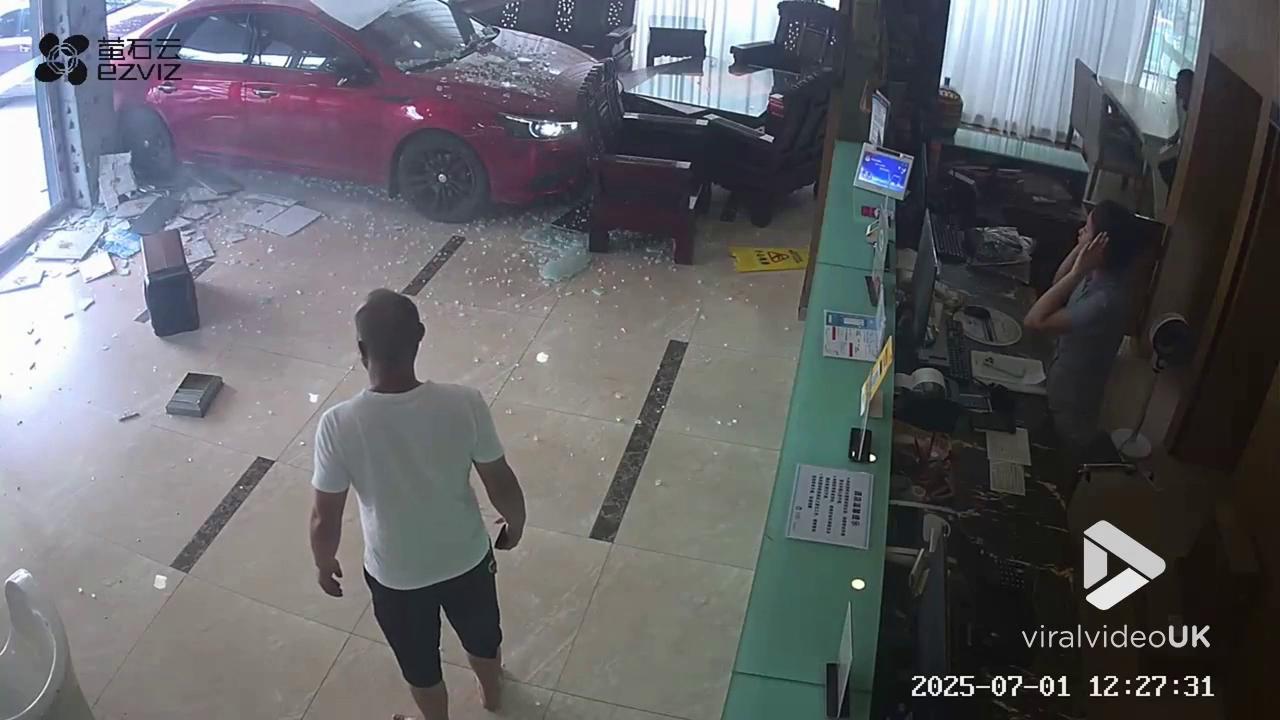 Video thumbnail for VV5025 CCTV catches small sedan suddenly crashing into a hotel.