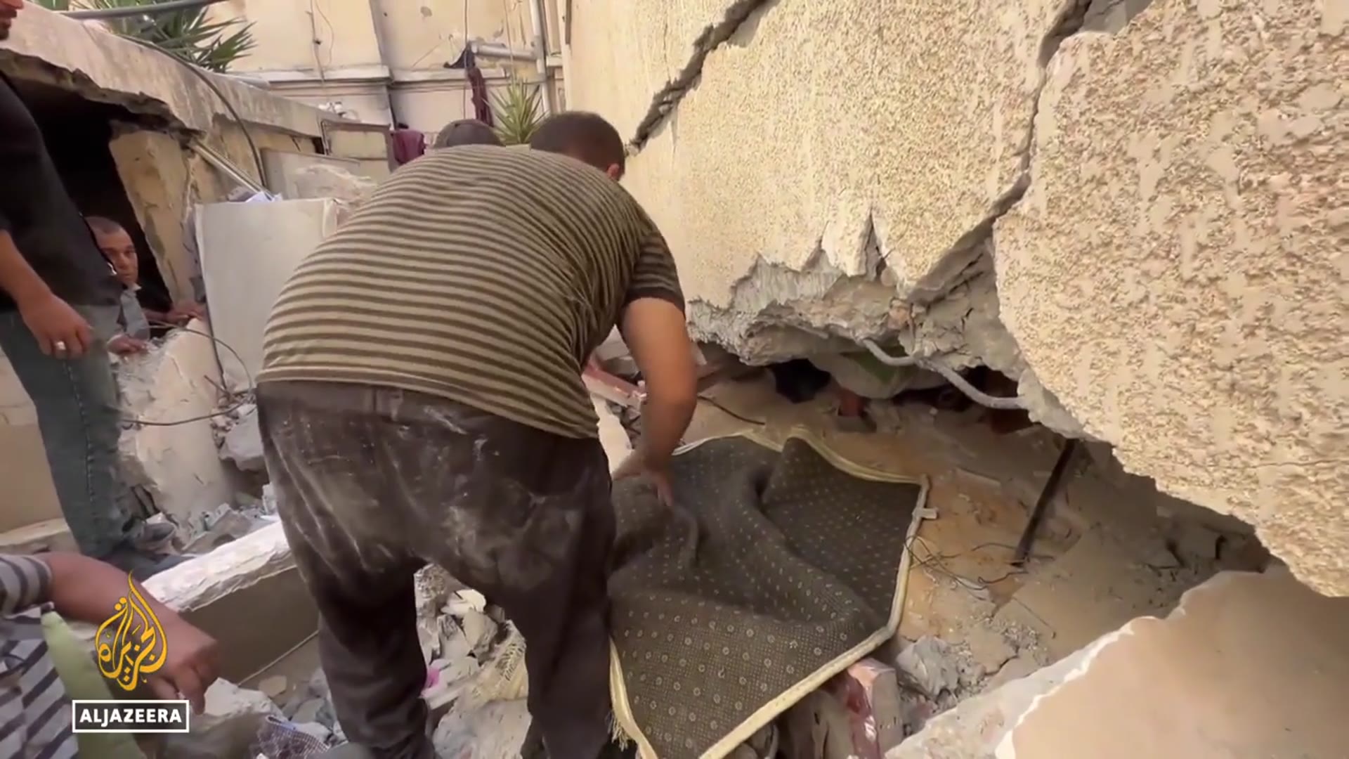 'Video thumbnail for Israeli strikes flatten homes in Gaza City as rescuers dig through rubble with their bare hands'
