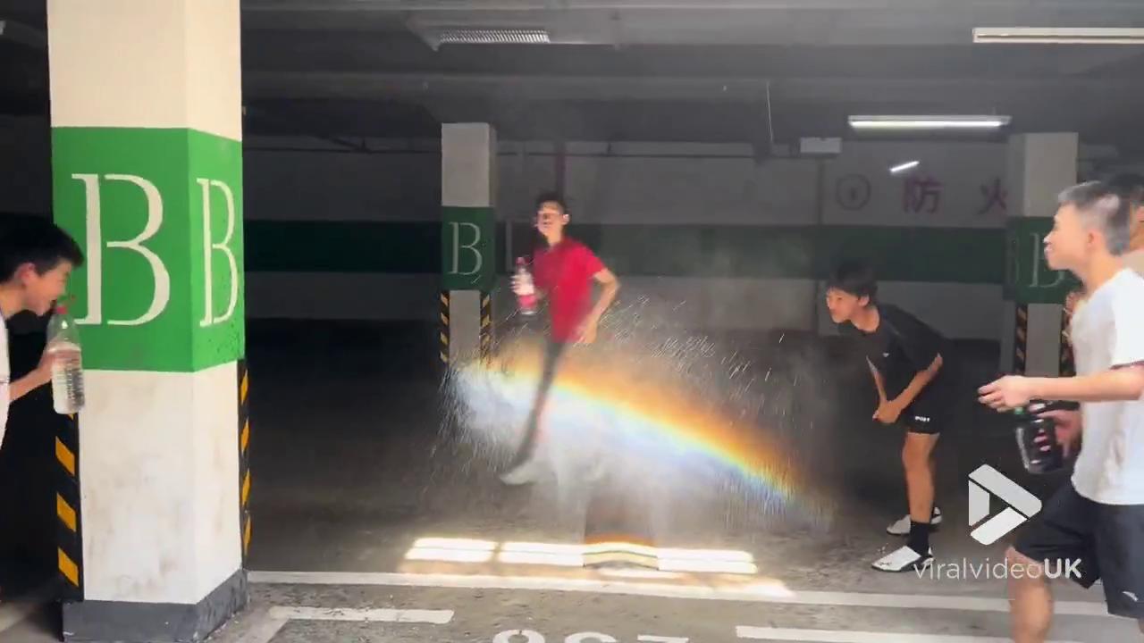 Video thumbnail for VV5007 Boys create artificial rainbow with water spray in
garage
