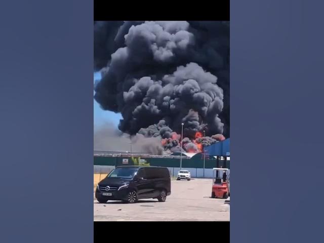 'Video thumbnail for Shocking moment warehouse explodes in Spain sending workers running and black smoke into space'