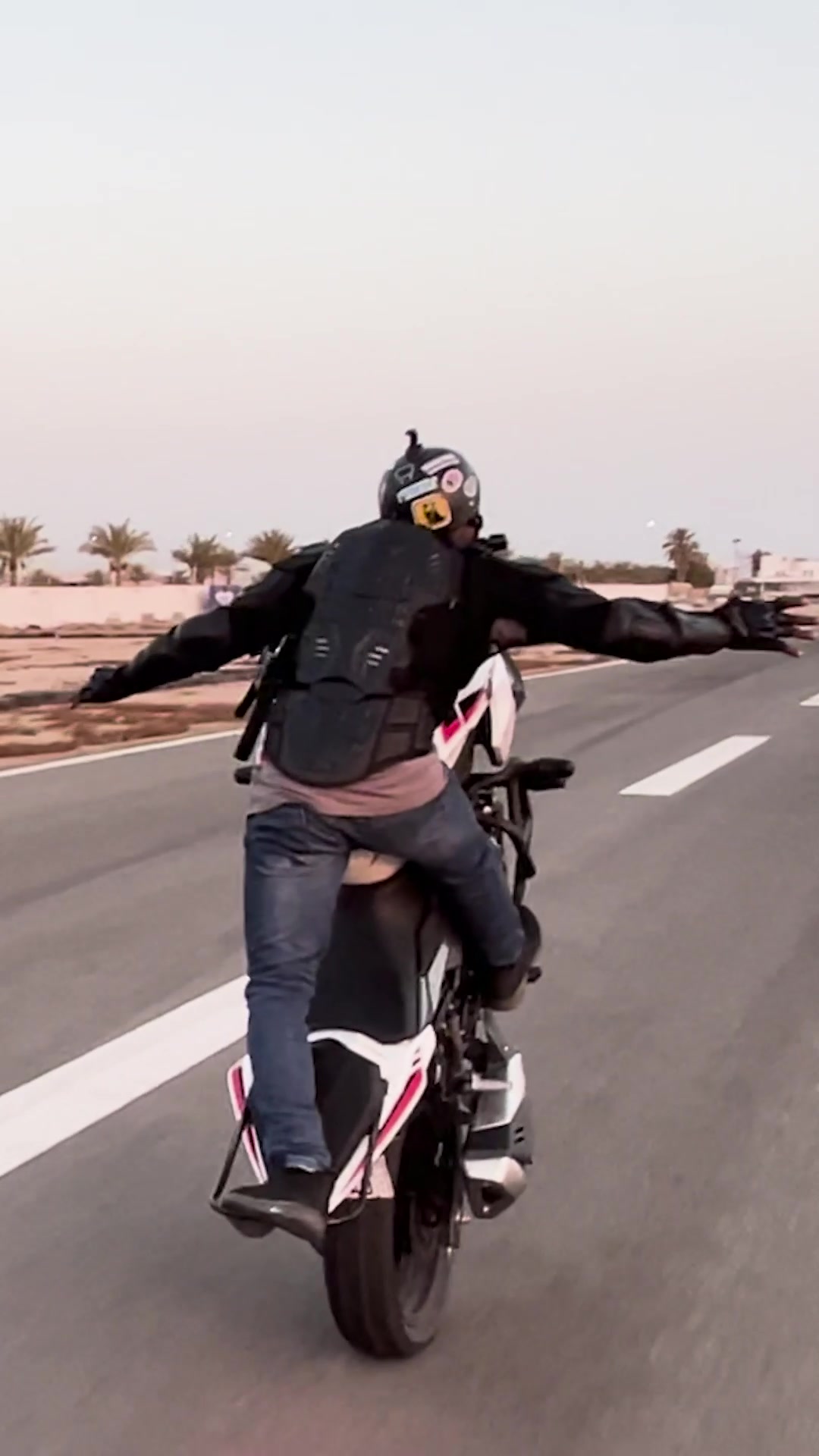 'Video thumbnail for Longest motorcycle wheelie held by mouth'