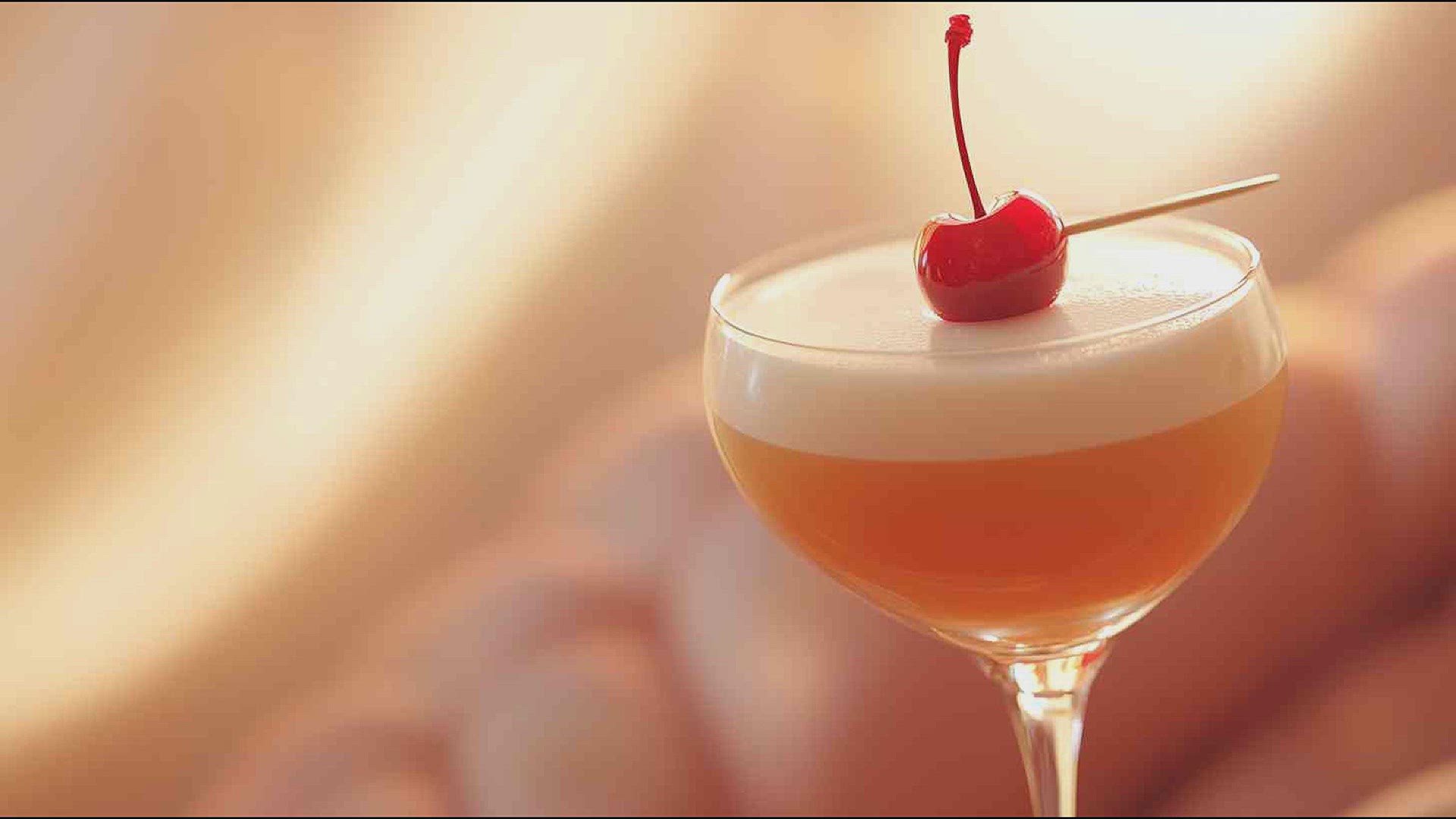 'Video thumbnail for Amaretto Sour with a Cherry Garnish Recipe'
