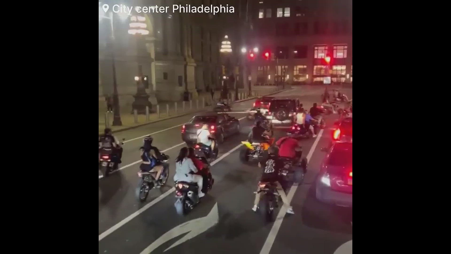 Video thumbnail for Motorcyclist shatters rear windshield during street takeover while armed with two kids inside
