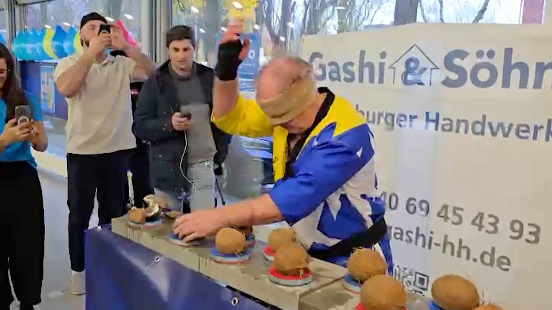 'Video thumbnail for Man nicknamed Hammerhands breaks coconuts blindfolded'