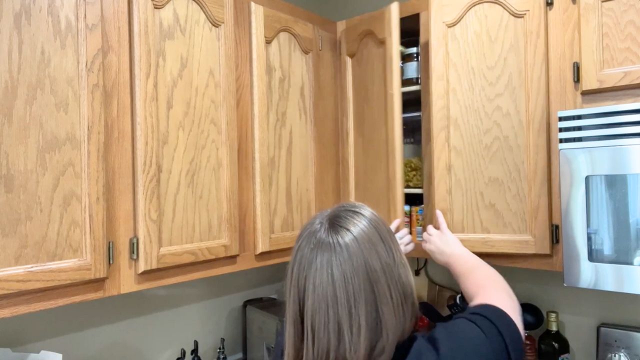 'Video thumbnail for She pulls tin cans from her cabinet for this GENIUS bathroom idea!'