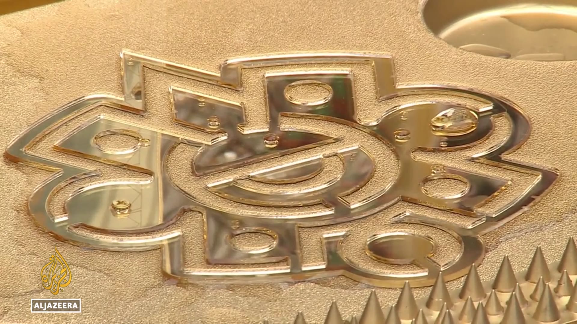 'Video thumbnail for NYC artist mocks Trump-era ICE with migrant tribute made from gold-painted street coolers'